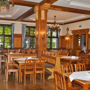 Photo of elegant restaurant interior with wood furniture for the fast food business